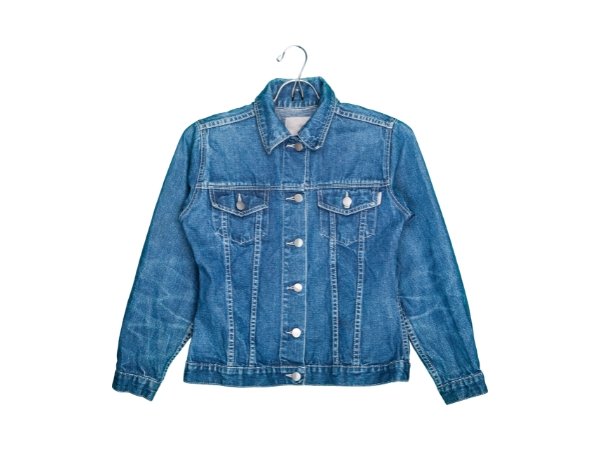 Blue denim jacket hanging on a wire hanger against a white background.
